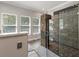 Modern bathroom featuring a walk-in shower with unique tile design and a glass enclosure at 2649 Starfish Dr, Johns Island, SC 29455