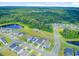 Aerial view of a residential community with ponds, and green surroundings at 266 Torslanda Ln, Summerville, SC 29486
