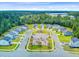 Neighborhood aerial featuring the playground, sidewalks, and lush green trees, for a Gathering friendly community at 266 Torslanda Ln, Summerville, SC 29486