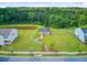 An aerial view of the community gazebo surrounded by lush greenery and manicured landscaping at 266 Torslanda Ln, Summerville, SC 29486