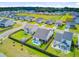 Aerial view of fenced yards with green lawns; one backyard features a pool, adding to outdoor enjoyment at 266 Torslanda Ln, Summerville, SC 29486