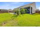 Spacious backyard with a pool, patio, lush green grass, and privacy fence at 266 Torslanda Ln, Summerville, SC 29486
