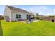 Expansive backyard featuring a private pool, screened porch, and well-maintained lawn at 266 Torslanda Ln, Summerville, SC 29486