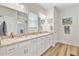 Bright bathroom features a double vanity with granite countertops, and framed mirrors at 266 Torslanda Ln, Summerville, SC 29486