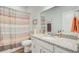 Bathroom showcases a toilet, vanity with countertop and decorative striped shower curtain at 266 Torslanda Ln, Summerville, SC 29486