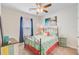 Cozy bedroom features a metal frame bed, a ceiling fan and large window at 266 Torslanda Ln, Summerville, SC 29486