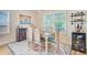 Bright dining room features a wooden table, coastal decor and luxury finishes at 266 Torslanda Ln, Summerville, SC 29486