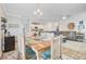 Open concept dining area features a wooden table and access to the kitchen and living room at 266 Torslanda Ln, Summerville, SC 29486