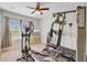 Carpeted exercise room with elliptical machine, ceiling fan and full workout machine at 266 Torslanda Ln, Summerville, SC 29486