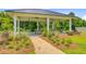 Charming community gazebo with picnic tables on a concrete patio for residents to enjoy at 266 Torslanda Ln, Summerville, SC 29486