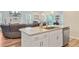 Kitchen island features granite countertops and views of the living spaces at 266 Torslanda Ln, Summerville, SC 29486