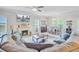 Open-concept living room features a cozy fireplace and adjacent dining area at 266 Torslanda Ln, Summerville, SC 29486
