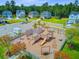 Outdoor neighborhood playground with climbing wall, slide, swings and picnic tables for hours of fun at 266 Torslanda Ln, Summerville, SC 29486