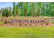 Entrance sign for Petterson Meadows with colorful flowers and greenery creating a welcoming ambiance at 266 Torslanda Ln, Summerville, SC 29486