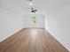 Spacious bedroom with natural light, complemented by wood flooring and a modern ceiling fan at 2872 Edenborough Rd, Johns Island, SC 29455