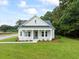 Charming single-story home featuring a welcoming front porch and a well-manicured lawn at 2872 Edenborough Rd, Johns Island, SC 29455