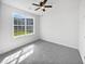 Sunlit bedroom with a window and neutral carpet at 2910 John Cabot Dr, North Charleston, SC 29420