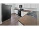 Well-lit kitchen with stainless steel appliances, ample cabinet space, and laminate countertops at 2910 John Cabot Dr, North Charleston, SC 29420