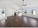 Bright open-concept living room featuring hardwood floors, recessed lighting and open access to the kitchen at 2910 John Cabot Dr, North Charleston, SC 29420