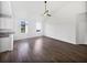 Spacious living room with hardwood floors, recessed lighting, and large windows showcasing natural light at 2910 John Cabot Dr, North Charleston, SC 29420