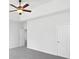 Main bedroom with neutral carpet, a ceiling fan, and a closet, providing ample storage space at 2910 John Cabot Dr, North Charleston, SC 29420