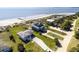 Beach house from above with neighboring homes and a scenic view of the coastline at 3004 Point St, Edisto Island, SC 29438