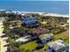 Aerial view showcasing beach homes with lush landscaping and stunning ocean views at 3004 Point St, Edisto Island, SC 29438