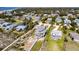Panoramic aerial view of the coastal neighborhood, highlighting the oceanfront beach home and its access path at 3004 Point St, Edisto Island, SC 29438
