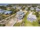 Aerial view of an elegant coastal community with ocean views and a spacious beach house with multiple decks at 3004 Point St, Edisto Island, SC 29438