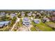 Expansive aerial view of beautiful coastal property, including a large home with multiple decks and neighborhood at 3004 Point St, Edisto Island, SC 29438