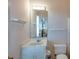Bathroom featuring a single sink vanity, toilet, and mirror with light fixture at 3004 Point St, Edisto Island, SC 29438