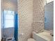 Charming bathroom featuring seashell wallpaper and a bright window at 3004 Point St, Edisto Island, SC 29438