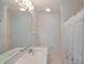 Clean bathroom featuring a large mirror and a shower with a white curtain at 3004 Point St, Edisto Island, SC 29438
