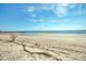 Serene beach view with clear blue skies and calm ocean waters at 3004 Point St, Edisto Island, SC 29438