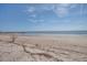 Seaside view of the property's beach with tranquil waters, offering a serene coastal experience at 3004 Point St, Edisto Island, SC 29438
