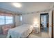 Bright bedroom with a white bed and a charming seating area at 3004 Point St, Edisto Island, SC 29438