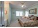 Bedroom featuring a bed with decorative pillows, window, fan, and artwork at 3004 Point St, Edisto Island, SC 29438