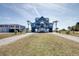 Spacious home with raised construction and sprawling front lawn at 3004 Point St, Edisto Island, SC 29438