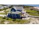 Spacious three story home with wrap around deck and boardwalk leading to the sandy shores of the beach at 3004 Point St, Edisto Island, SC 29438