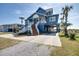 Quaint beach house with well-manicured landscaping and ample parking space at 3004 Point St, Edisto Island, SC 29438