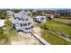 Angle shot of a lovely three-story beach house with decks and boardwalk that connects it to the beach at 3004 Point St, Edisto Island, SC 29438