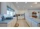 Spacious kitchen with white cabinets and countertops, and stainless steel appliances at 3004 Point St, Edisto Island, SC 29438