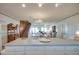 Open layout with kitchen island, dining area, and staircase at 3004 Point St, Edisto Island, SC 29438