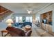 Spacious living room with ceiling fan, comfortable seating, and staircase at 3004 Point St, Edisto Island, SC 29438