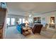 Comfortable living room with plush seating, ceiling fan, and access to outdoor balcony at 3004 Point St, Edisto Island, SC 29438
