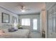 Cozy bedroom with a bay window, ceiling fan, closet, and outside access at 3004 Point St, Edisto Island, SC 29438