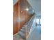 Traditional staircase with wood paneling and carpeted steps at 3004 Point St, Edisto Island, SC 29438