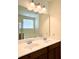 Bright bathroom with a double sink vanity, a large mirror, and good lighting at 3006 Central Ring Ct, Ridgeville, SC 29472