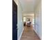 Bright entryway showcasing wood-look flooring, neutral walls, and an adjacent coat closet at 3006 Central Ring Ct, Ridgeville, SC 29472