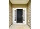 Inviting front entrance with a black door and sidelights providing natural light to the entryway at 3006 Central Ring Ct, Ridgeville, SC 29472